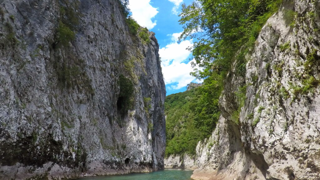 The green waters of the Neratva river took us through canyons with steep limestone cliffs